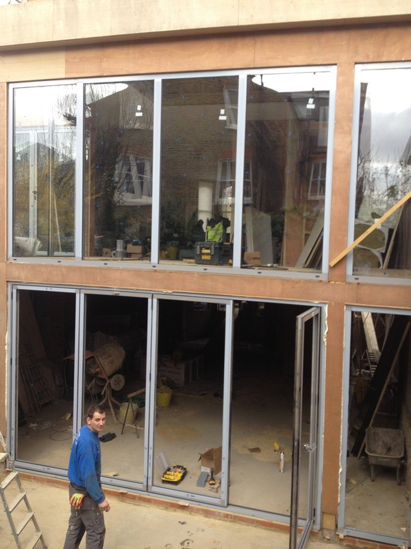 Aluminium bi-fold doors with two-storey glazing in Clapham