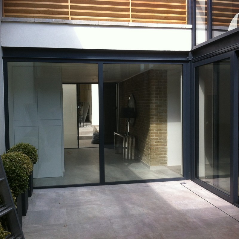 Floor-to-ceiling sliding doors opening to courtyard in Clapham
