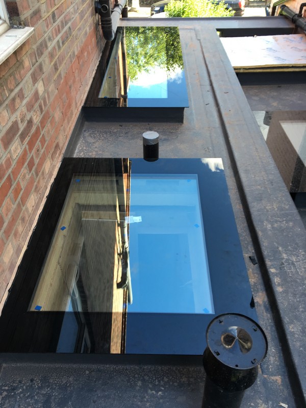 Multiple flat roof skylights on extension in Clapham