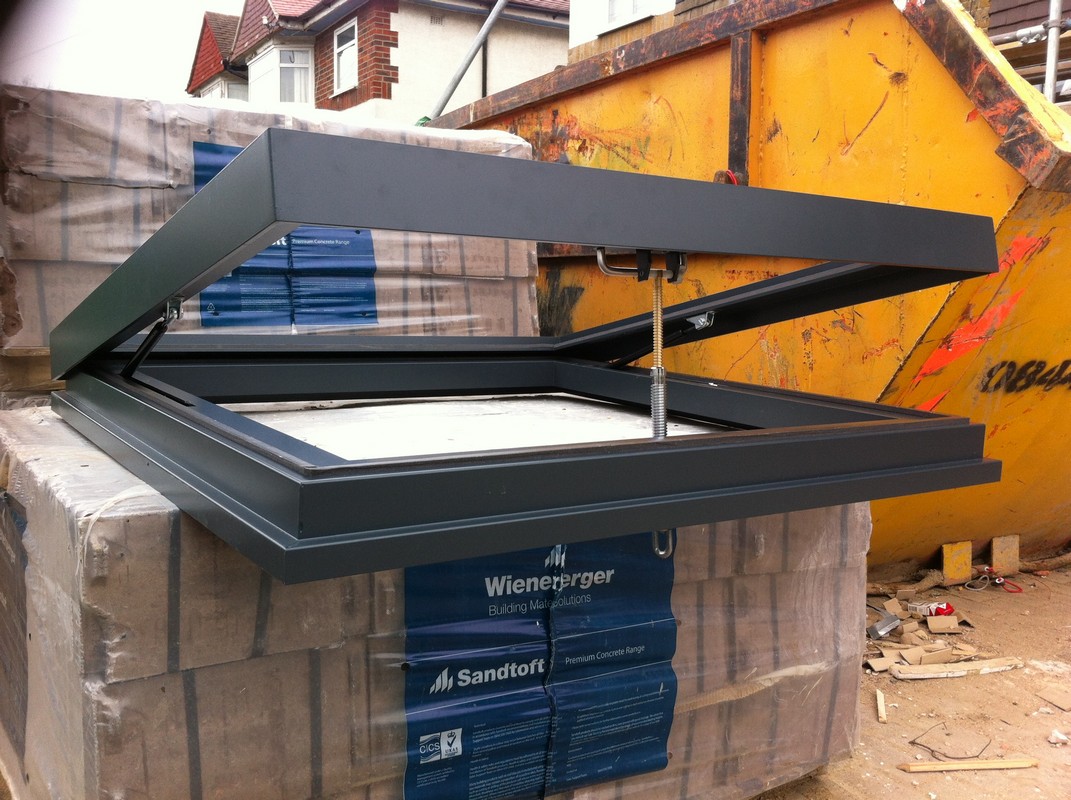 Opening flat roof skylight in anthracite grey installed in Clapham